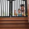 Space divider 70 cm high safety grid 4-panel protective fence to protect dogs or children black protective fence