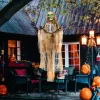Animált függő csontváz halloween dekoráció 183 cm hosszú zölden világító fejjel és vörös mellkassal