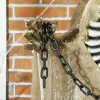 Animált függő csontváz halloween dekoráció 183 cm hosszú zölden világító fejjel és vörös mellkassal