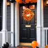 Világító halloween ajtókoszorú 44 cm-es tökfejjel, 44 LED-del és őszi levelekkel