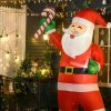 Felfújható karácsonyi dekoráció 240 cm világító Mikulás cukorpálcával, LED-fénnyel beltéri és kültéri használatra