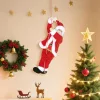 Éneklő és mászó Mikulás figura 60 cm magas, hangra aktiválódó, karácsonyi zenével és ajándékzsákkal