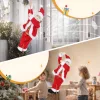 Éneklő és mászó Mikulás figura 60 cm magas, hangra aktiválódó, karácsonyi zenével és ajándékzsákkal
