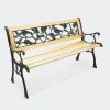 Cast iron garden bench with floral backrest and wooden seat with cast iron frame