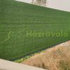 Economical artificial grass with 20 mm fibers can be used as a wall panel 2x25 meter roll 3 shades of green brilliant color easy installation min. 5000m2