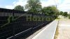 Polyrattan privacy tape, 80 meter roll, wind deflector that can be attached to a beige fence