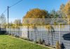 Polyrattan privacy tape 255 cm long 19 cm high light gray wind deflector that can be attached to a fence